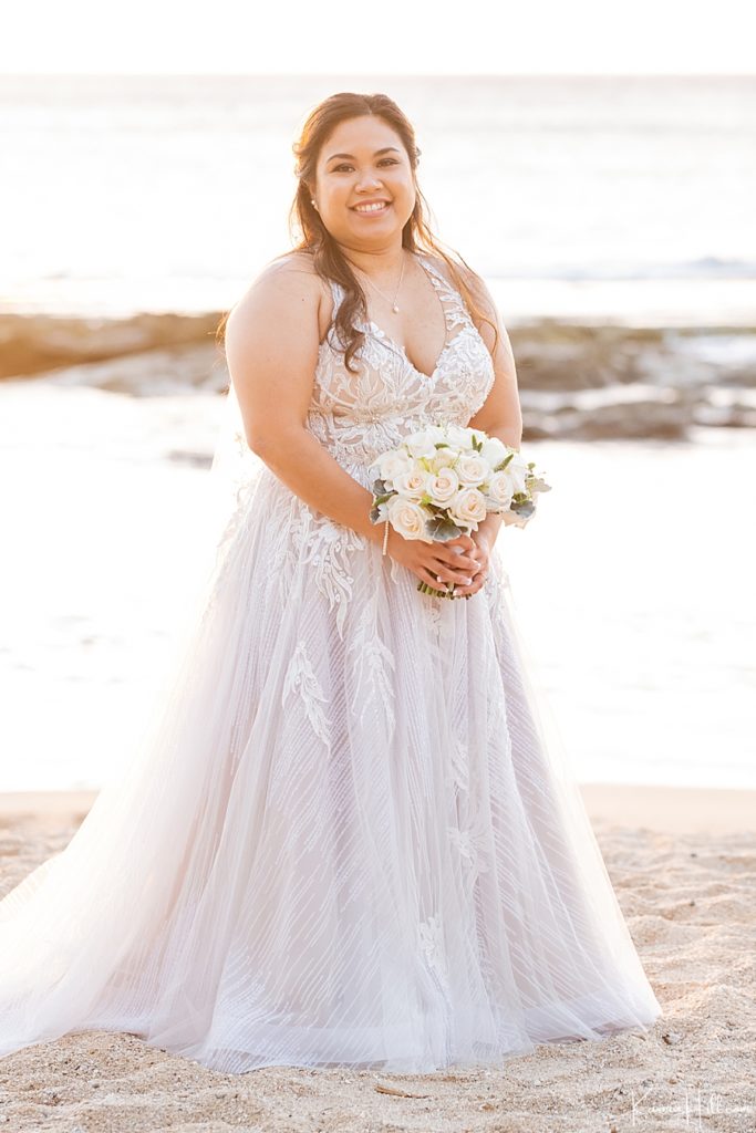 pacific island bride with lace gown and white rose bouquet 