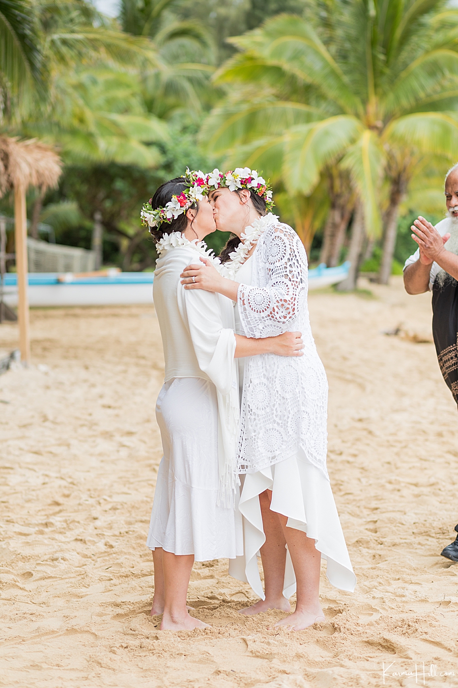 first kiss with two brides during a real hawaii wedding 
