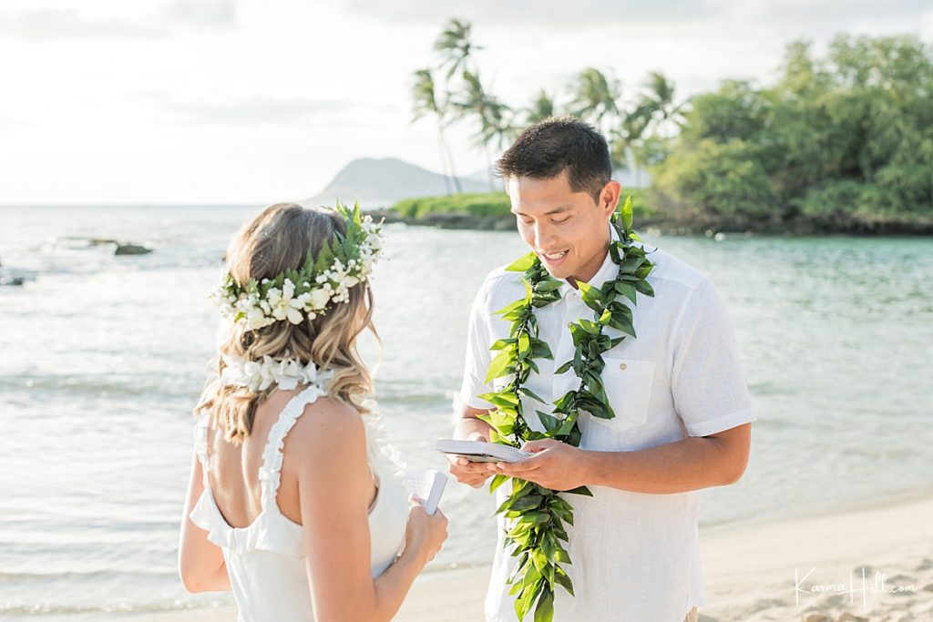 cute photo of couple exchanging vows on hawaii beach 