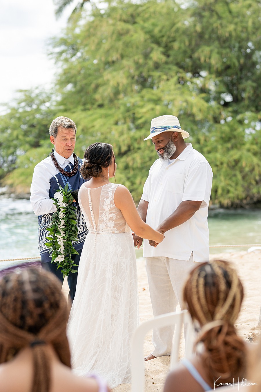 the groom gives the bride a cute smile as they marry in oahu 