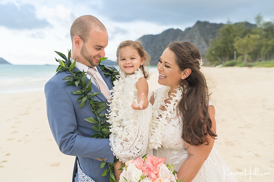 bride and groom with daughter