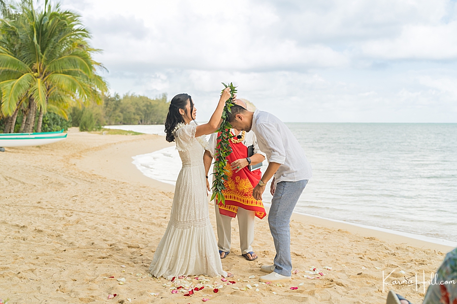 bride exchange leis at Hawaii wedding