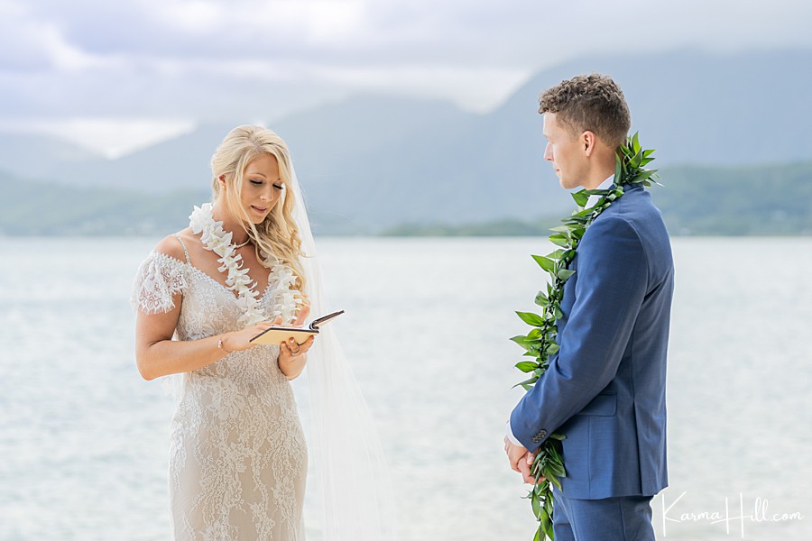 bride telling vows to groom at oahu wedding