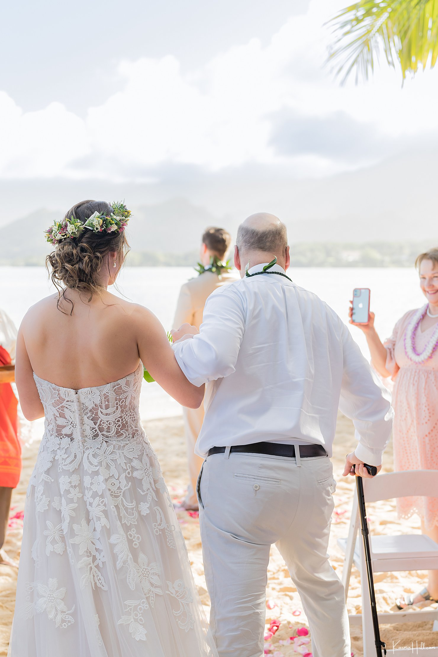 bride walking down aisle at kualoa secret island venue wedding