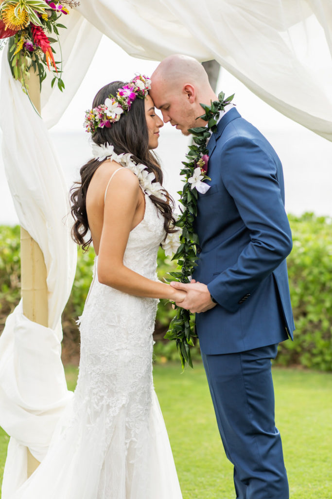 Romantic Oahu Wedding at a venue with arch