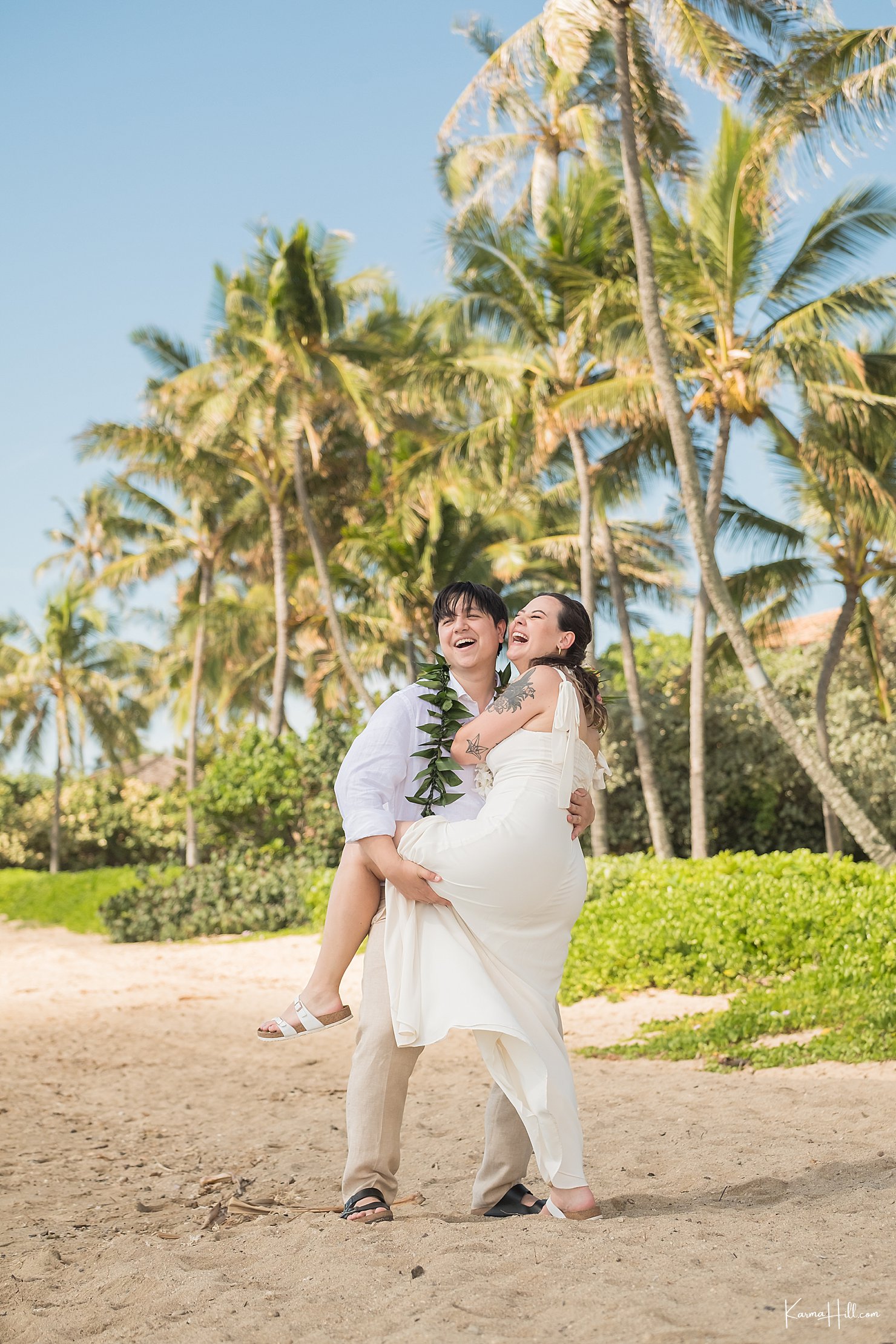 palm trees with newlyweds on beach