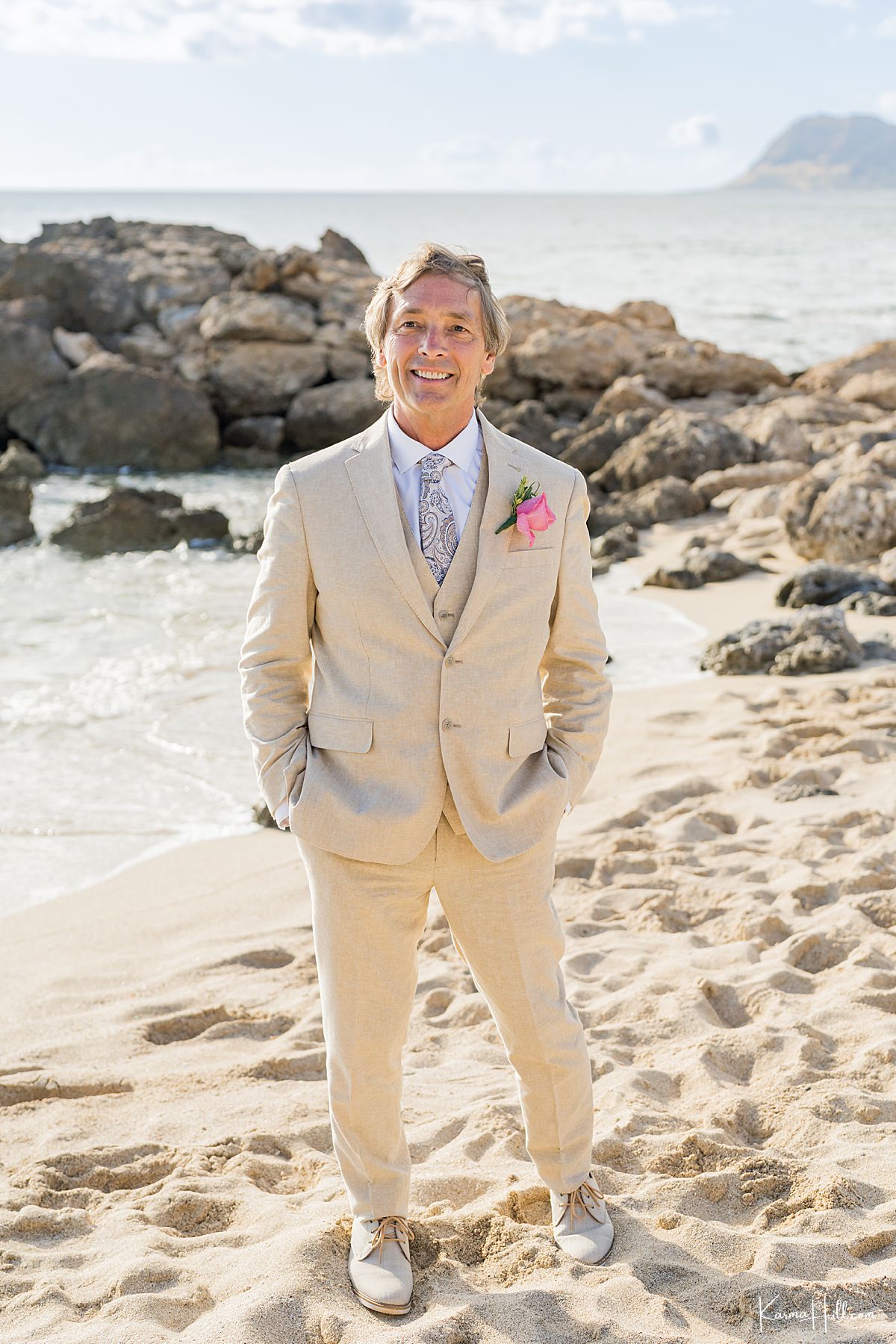 groom on beach 